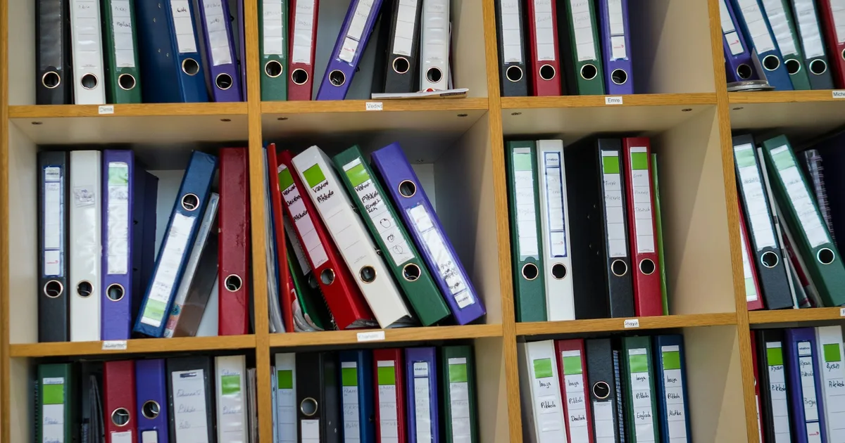 Labelled folders arranged on a shelf