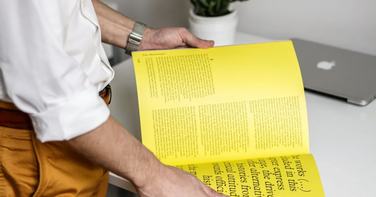Someone highlighting lines on a printed document